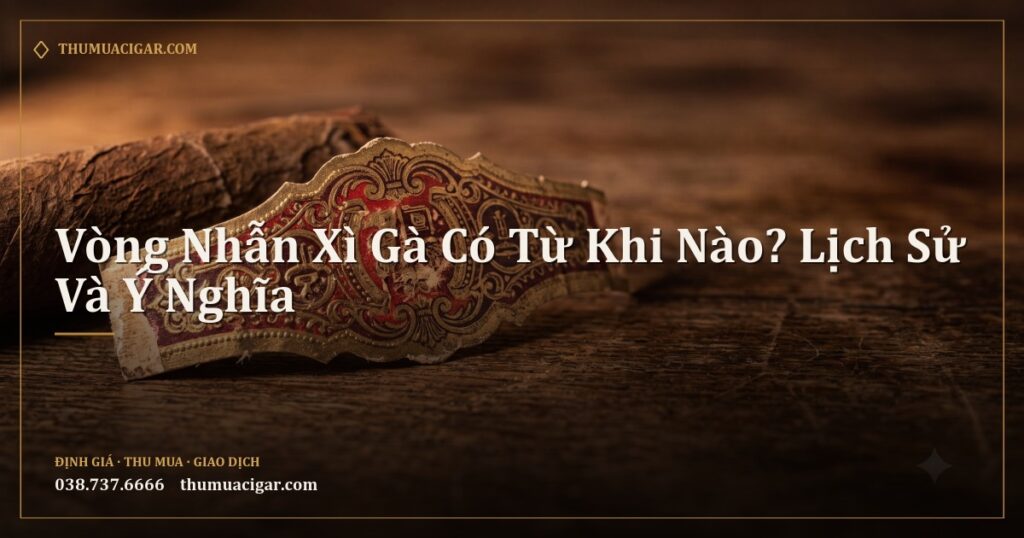 Vòng nhẫn xì gà giấy cũ hoa văn phức tạp trên bàn gỗ cạnh điếu xì gà
