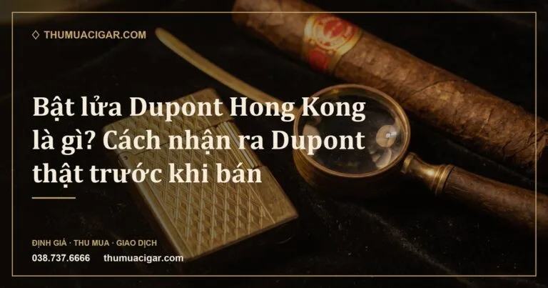 Bật lửa mạ vàng khắc hoa văn kim cương đặt cạnh kính lúp và điếu xì gà (ảnh minh hoạ)